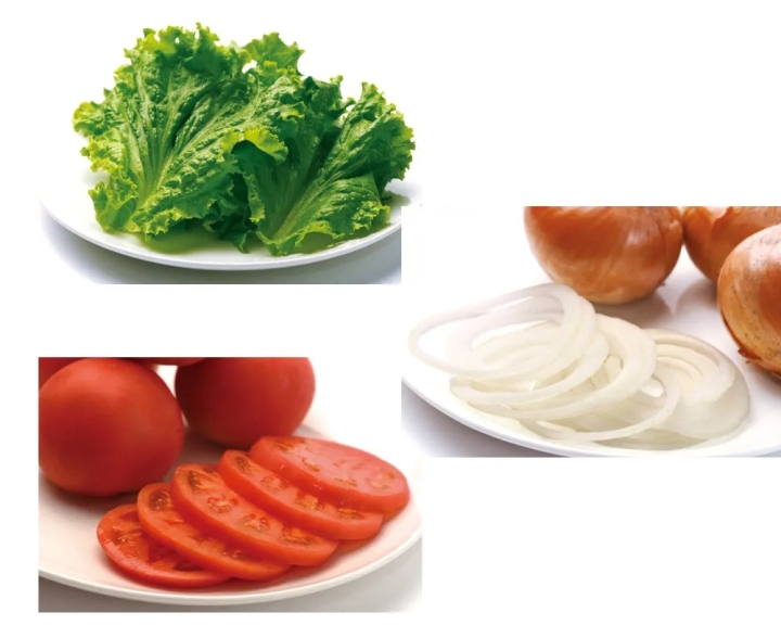 レタス、トマト、玉ねぎのスライスが白いお皿に載っている写真です。