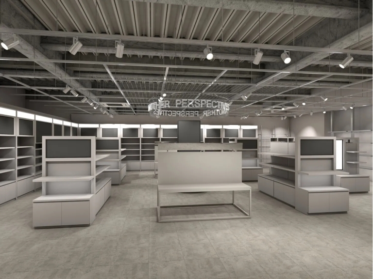 店内を写した画像。白を基調とした内装で、棚やディスプレイが配置されている。天井には照明が設置されており、スタイリッシュな印象を与える。